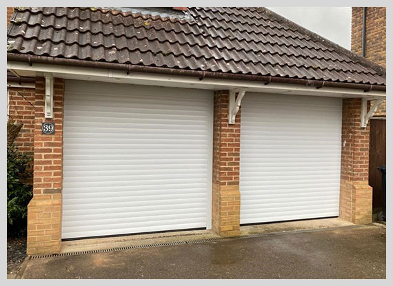 White roller garage door by Britannia Garage Doors, showcasing a clean and modern design.