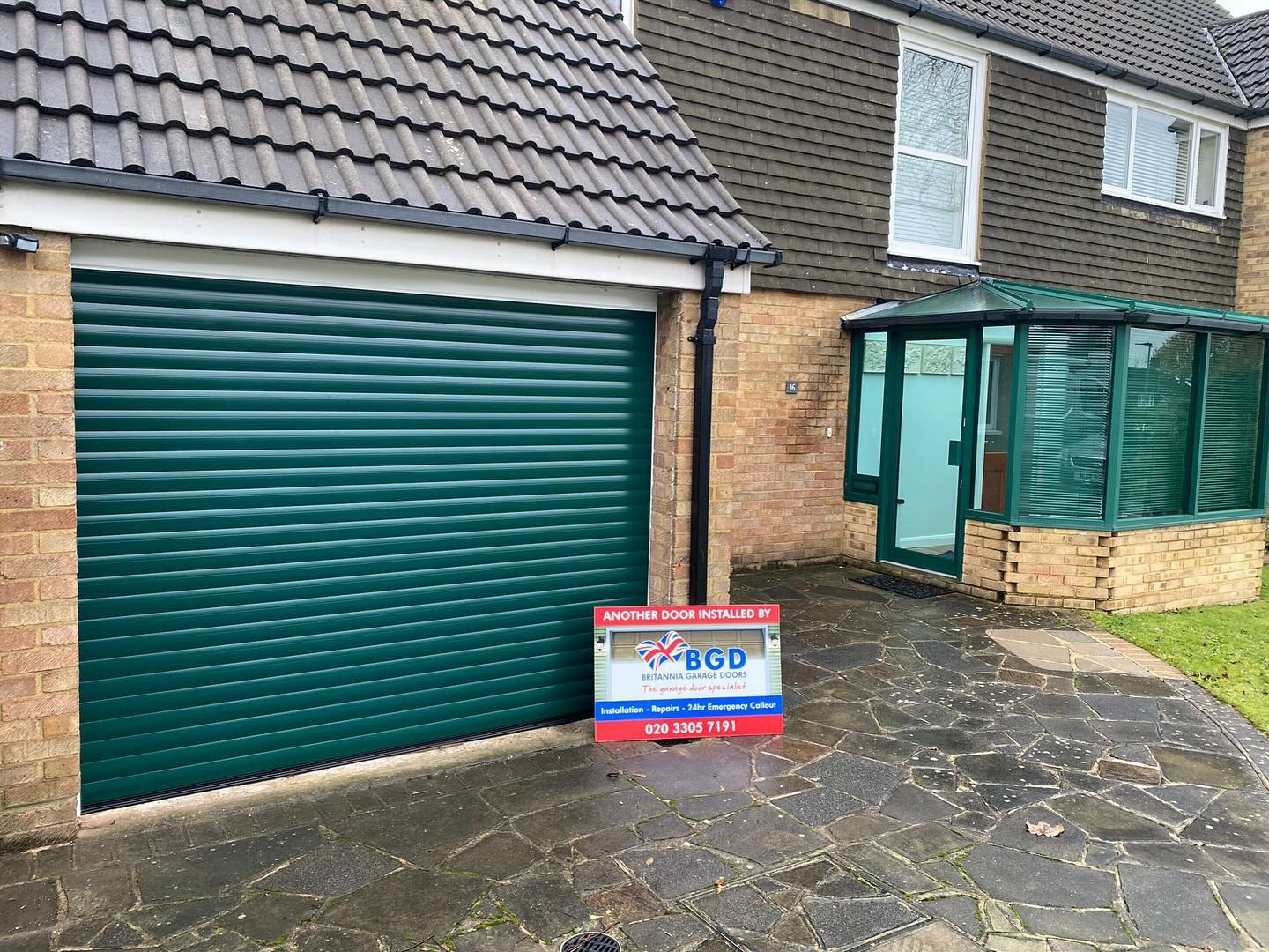 Green roller door replaced by Britannia Garage Doors.